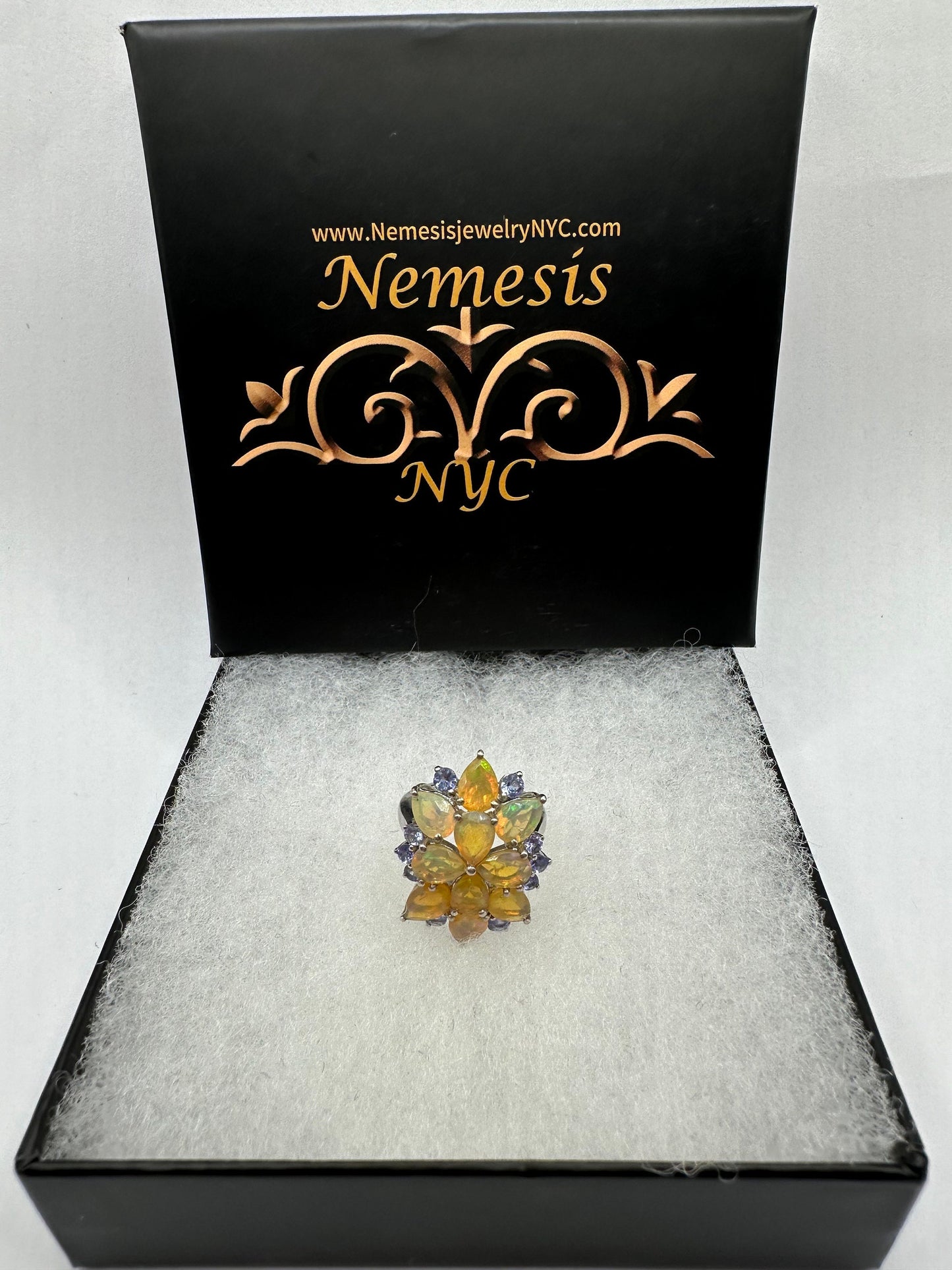 Vintage Orange Ethiopian Fire Opal surrounded by Blue Tanzanite Sterling Silver Rhodium Ring