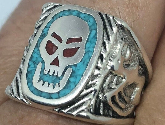 Skull ring with blue turquoise and red coral in white bronze on finger