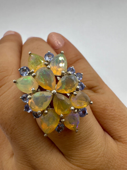 Vintage Orange Ethiopian Fire Opal surrounded by Blue Tanzanite Sterling Silver Rhodium Ring